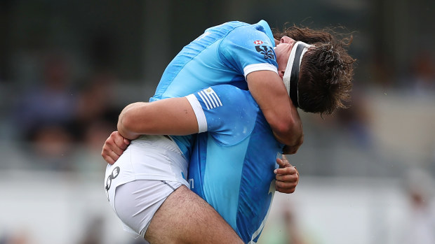 Uruguay players in celebration after defeating New Zealand.