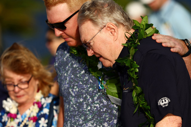 From right, Eric Murray, Cameron Murray, and Terry Murray participate in a Celebration of Life service honouring Grayson Murray.
