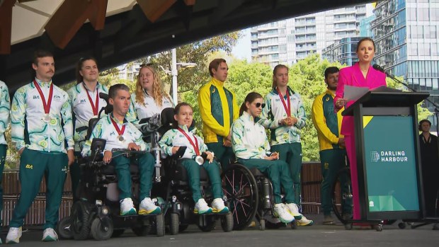 Ally Langdon presents athletes at Friday's meet and greet in Darling Harbour.