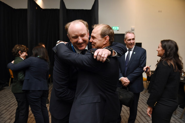 Brett Robinson is congratulated by Phil Waugh.