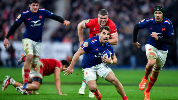 Antoine Dupont of France runs with the ball at Stade de France.
