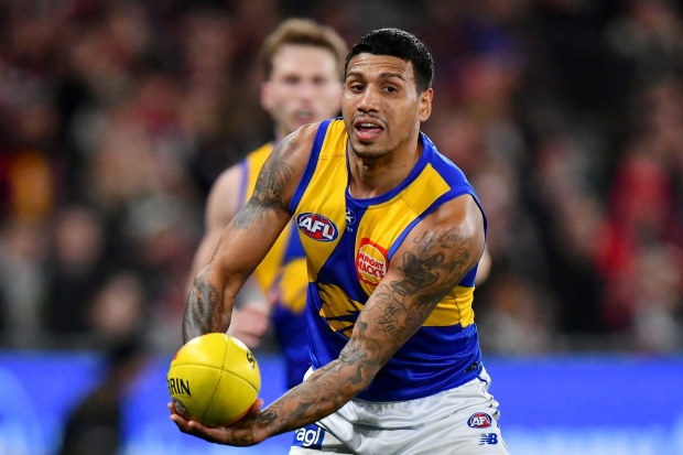 Tim Kelly of the Eagles handballs in round 19, 2024.