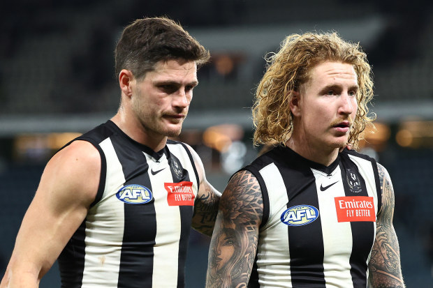 Jack Crisp and Beau McCreery of the Magpies look dejected after their round 12 loss.