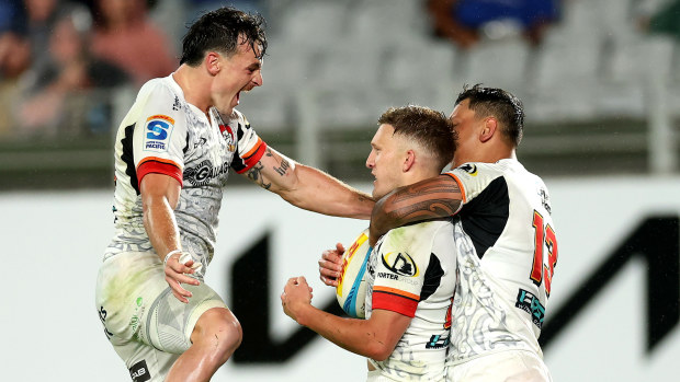 Leroy Carter of the Chiefs celebrates a try to Damian McKenzie.
