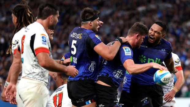 Dalton Papali'i of the Blues celebrates after scoring a try with Cameron Suafoa.