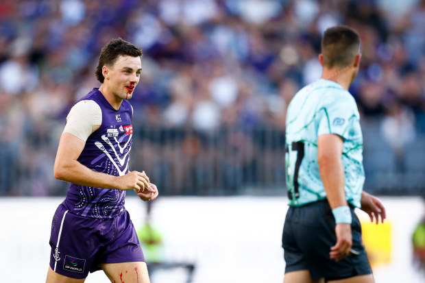 Jordan Clark of the Dockers leaves the field under the blood rule during the 2025 Indigenous All-Stars match.