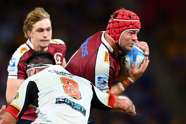 Harry Wilson of the Reds is tackled.