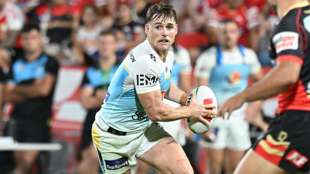 AJ Brimson of the Titans looks to pass.