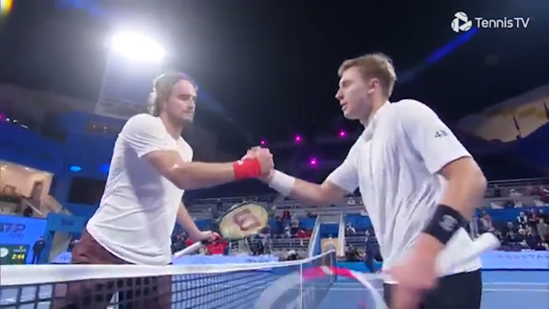 Hamad Medjedovic shakes hands with Stefano Tsitsipas at the Qatar Open.