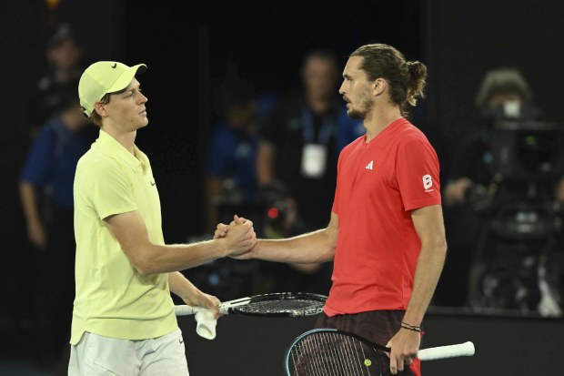 Jannik Sinner (left) and Alexander Zverev embrace after the final.