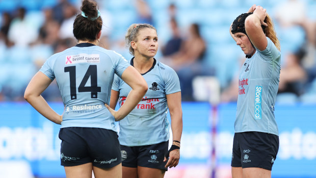 Waratahs players display disappointment.