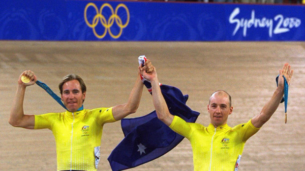 Scott McGrory (left) and Brett Aitken celebrate winning madison gold at the Dunc Gray Velodrome during the Sydney 2000 Olympic Games.