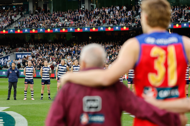 Players and coaches line up during the 2024 AFL second preliminary final match between the Geelong Cats and the Brisbane Lions at the Melbourne Cricket Ground on September 21, 2024 in Melbourne, Australia. (Photo by Dylan Burns/AFL Photos via Getty Images)