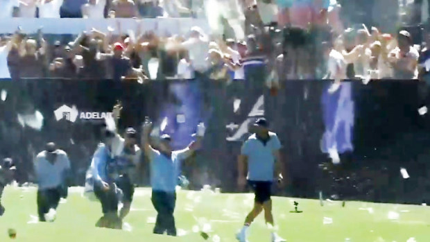 Patrick Reed is showered in beer after his Adelaide hole in one.