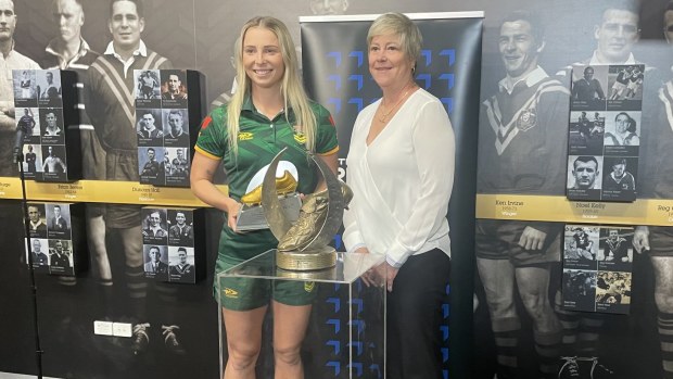 Tarryn Aiken is presented the IRL Woman's Golden Boot trophy by NRL Hall of Famer Tarsha Gale.