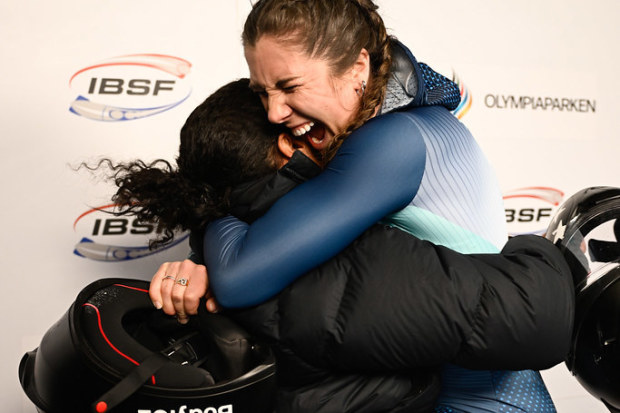 Bree Walker (blue suit) and Kaysha Love embrace after sharing gold.