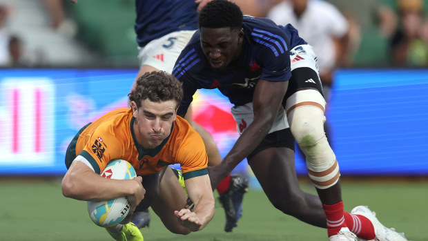 Ben Dowling of Australia crosses for a try.