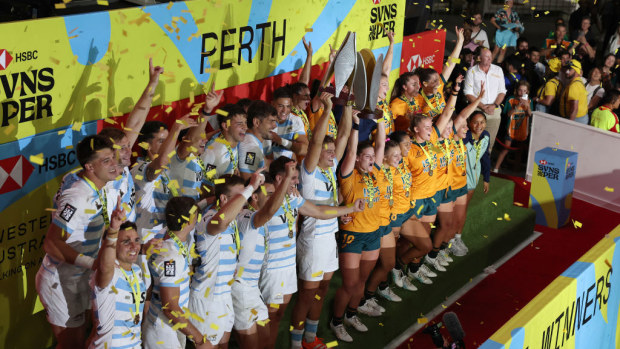 Argentina and Australia celebrate with the trophies.