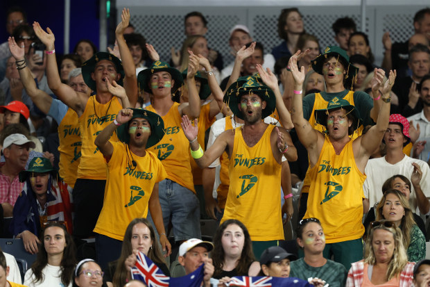 Fans show their support as they watch the Men's Singles Second Round match between Thanasi Kokkinakis of Australia and Jack Draper of Great Britain during day four of the 2025 Australian Open at Melbourne Park on January 15, 2025 in Melbourne, Australia. (Photo by Daniel Pockett/Getty Images)