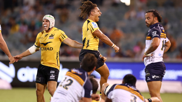 Western Force players celebrate winning the round two Super Rugby Pacific match.