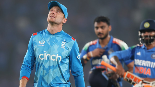 Jos Buttler walks off the field.