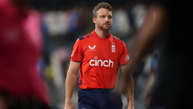 Jos Buttler of England makes his way off the field.