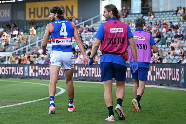 Marcus Bontempelli departs the field with a calf issue.