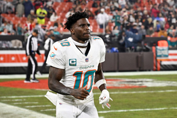 Tyreek Hill #10 of the Miami Dolphins runs onto the field.