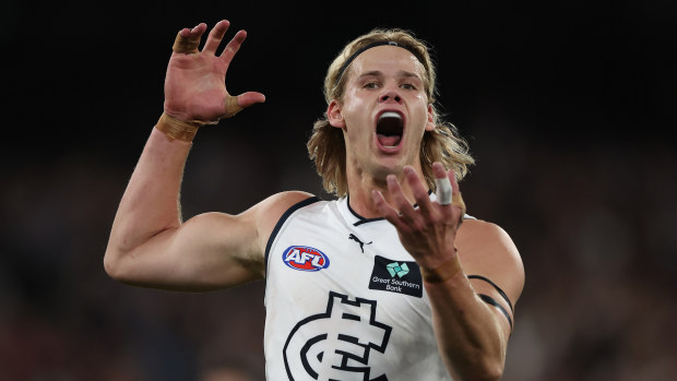 MELBOURNE, AUSTRALIA - SEPTEMBER 15: Tom De Koning of the Blues celebrates after scoring a goal during the AFL First Semi Final match between Melbourne Demons and Carlton Blues at Melbourne Cricket Ground, on September 15, 2023, in Melbourne, Australia. (Photo by Robert Cianflone/Getty Images)