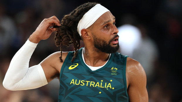Patty Mills of Australia reacts.