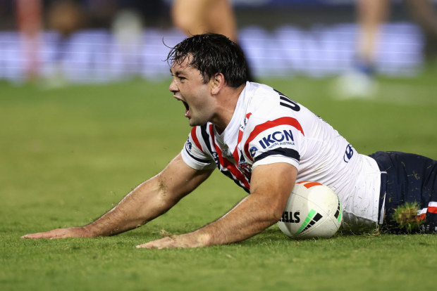 Brandon Smith of the Roosters scores a try against the Newcastle Knights.