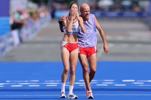 Elena Congost of Team Spain celebrates finishing third and taking the Bronze Medal with her guide Mia Carol Bruguera.