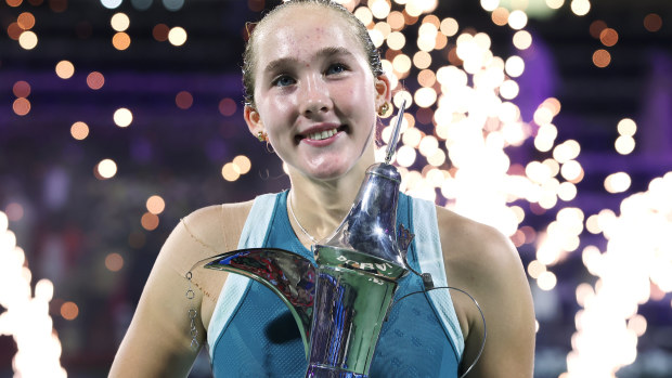 Mirra Andreeva celebrates with the trophy after victory over Clara Tauson of Denmark in the final during day seven of the Dubai Duty Free Tennis Championships, part of the Hologic WTA Tour at Dubai Duty Free Tennis Stadium on February 22, 2025 in Dubai, United Arab Emirates. (Photo by Christopher Pike/Getty Images)