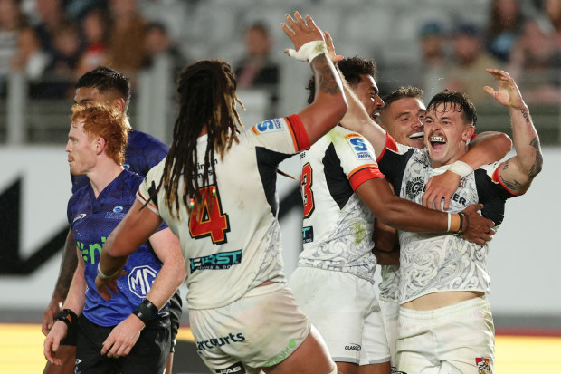 Leroy Carter of the Chiefs celebrates after scoring a try.