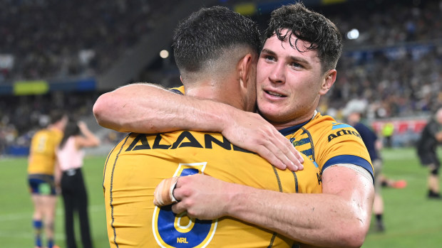 Mitchell Moses hugs Dylan Brown following the NRL Preliminary Final match between the North Queensland Cowboys and the Parramatta Eels at Queensland Country Bank Stadium on September 23, 2022, in Townsville, Australia. (Photo by Bradley Kanaris/Getty Images)