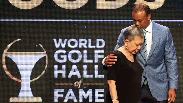 Tiger Woods and his mother Kultida Woods react as they pose for photos prior to his induction at the 2022 World Golf Hall of Fame Induction at the PGA TOUR Global Home on March 09, 2022 in Ponte Vedra Beach, Florida. (Photo by Sam Greenwood/Getty Images)