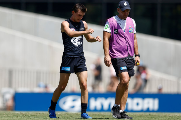 Jagga Smith limps from the field during a practice match.
