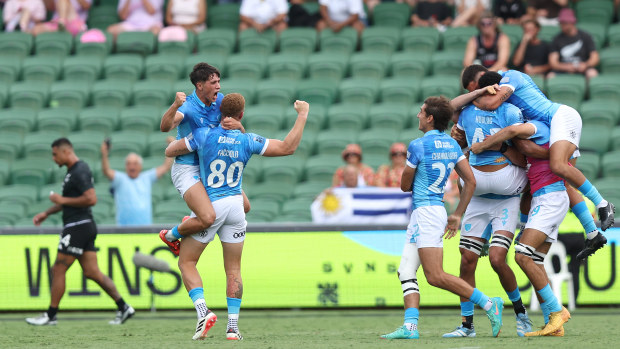 Uruguay players celebrating their win against New Zealand.