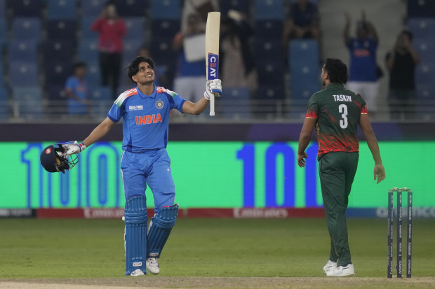 India's Shubman Gill celebrates after scoring a century.