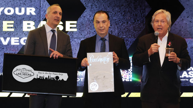 Clark County Commissioner chairman Tick Segerblom presents NRL boss Andrew Abdo and chairman of the Australian Rugby League Commission Peter V'landys with a ceremonial key to the Las Vegas Strip during the NRL Las Vegas media launch.