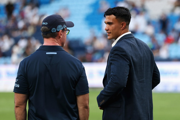 Waratahs coach Dan McKellar speaks with Joseph-Aukuso Suaalii at Allianz Stadium.