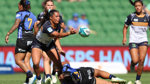 Merania Paraone of the Brumbies passes the ball.