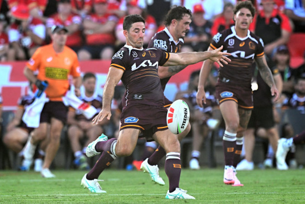 Ben Hunt of the Broncos kicks the ball.