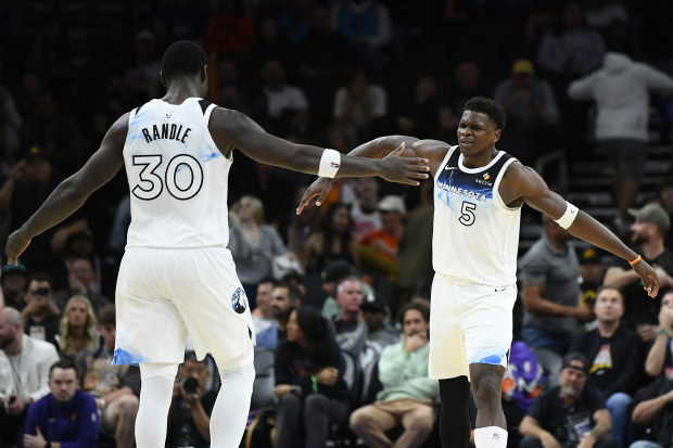 Anthony Edwards celebrates with Minnesota teammate Julius Randle.