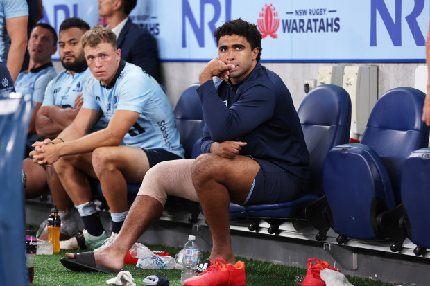 Langi Gleeson of the Waratahs on the bench.