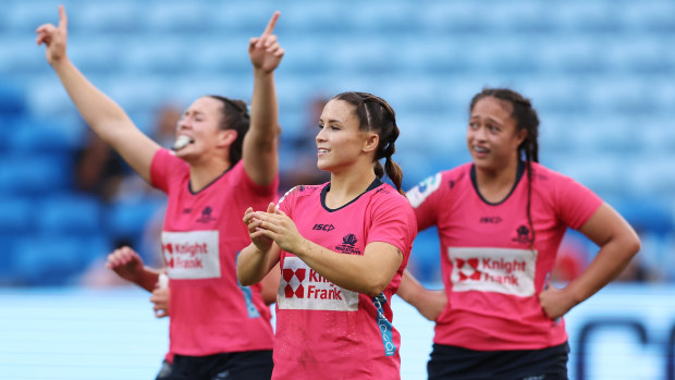 Waratahs players celebrating their victory.