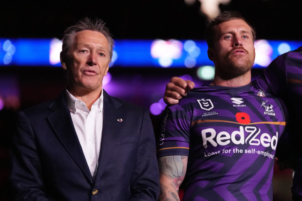 Craig Bellamy (left) and Cameron Munster singing the national anthem on Anzac Day in 2024.