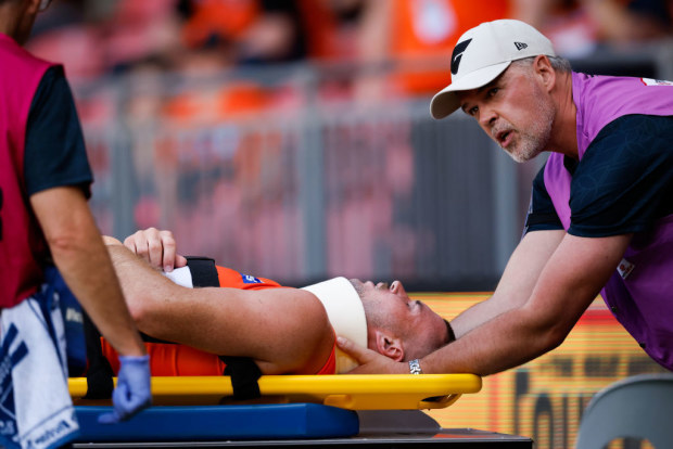 Kieren Briggs of the Giants is seen injured being carried off on a stretcher.