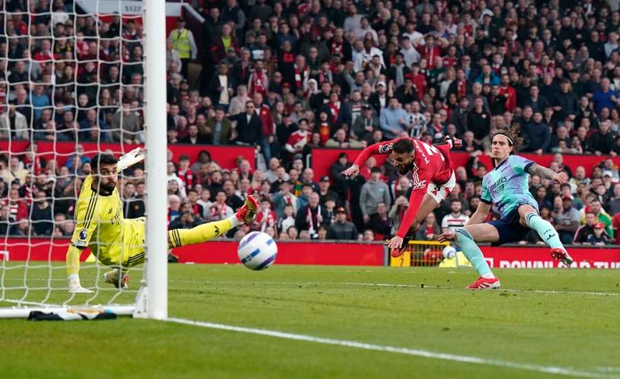 Arsenal's David Raya saves from Man United's Noussair Mazraoui