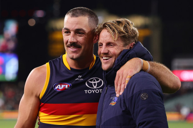 Taylor Walker (left) and Rory Sloane in Adelaide colours.
